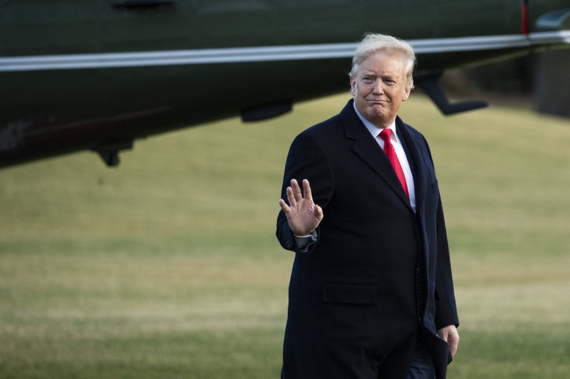 President Donald Trump waves as he arrives at the White House, Friday, Feb. 7, 2020, in Washington, as he returns from a trip to Charlotte, N.C. (AP Photo/Manuel Balce Ceneta)