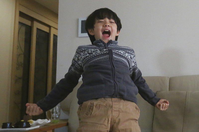 Parasite actor Jeong Hyeonjun celebrates as he watches a TV live broadcasting of South Korean director Bong Joon Ho receiving the award for best original screenplay for "Parasite" at the Oscars, at his house in Seoul, South Korea, Monday, Feb. 10, 2020. (AP Photo/Ahn Young-joon) story.lead_photo.caption