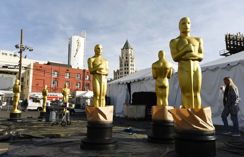 Oscar statues stand outside Hollywood Boulevard in preparation for Sunday's 92nd Academy Awards at the Dolby Theatre, Wednesday, Feb. 5, 2020, in Los Angeles. (AP Photo/Chris Pizzello) story.lead_photo.caption