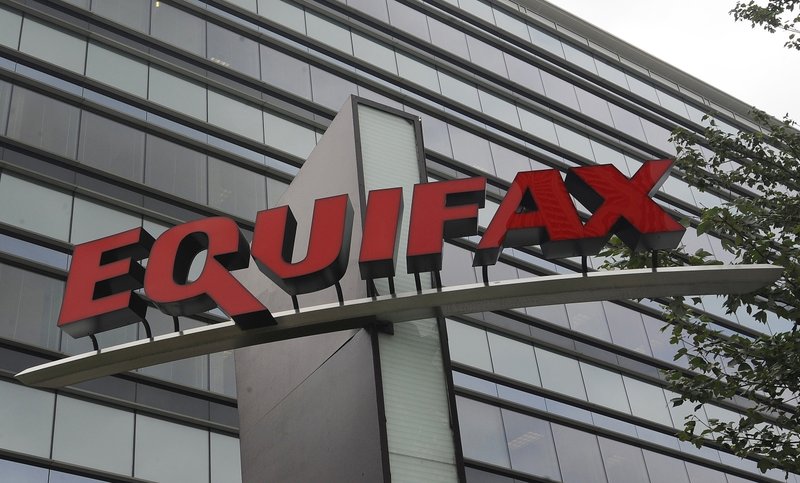 FILE - This July 21, 2012, file photo shows signage at the corporate headquarters of Equifax Inc. in Atlanta. The deadline to seek cash payments and claim free services as part of Equifax's $700 million settlement over a massive data breach is Wednesday, Jan. 22, 2020. (AP Photo/Mike Stewart, File)

