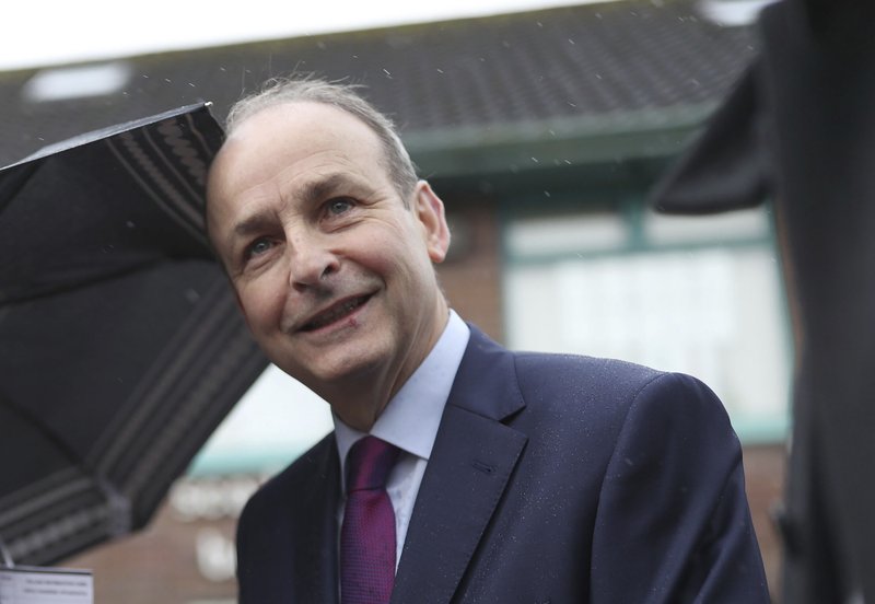 Ireland's Fianna Fail party leader Micheal Martin after voting in the Irish General Election in Ballinlough, near Cork, Ireland, Saturday Feb. 8, 2020. Voting is under way in Ireland for what is widely predicted to be an unpredictable outcome.(Yui Mok/PA via AP)