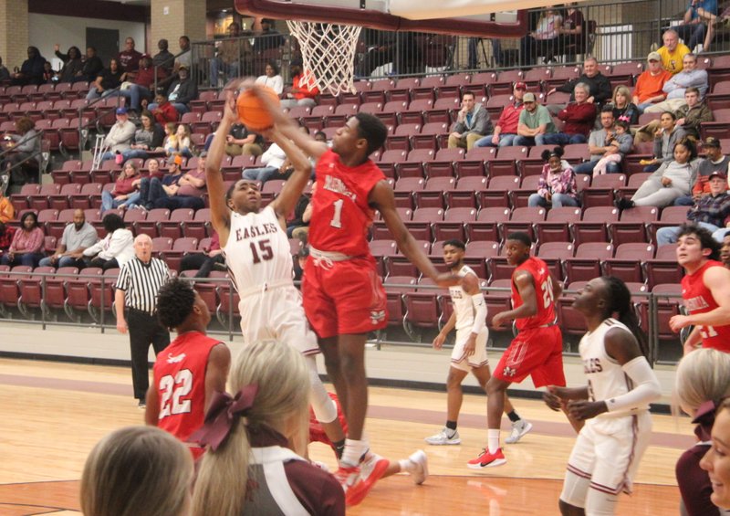 Magnolia sophomore Devonte Walker blocks a shot during action last week at Crossett. The Panthers have three conference games remaining before the region tournament starts Feb. 26.