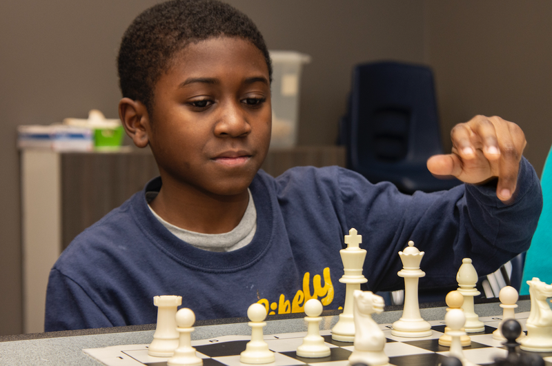 CPR Chess Club member Abram Burnett ponders a game move.

(Arkansas Democrat-Gazette/Cary Jenkins)
