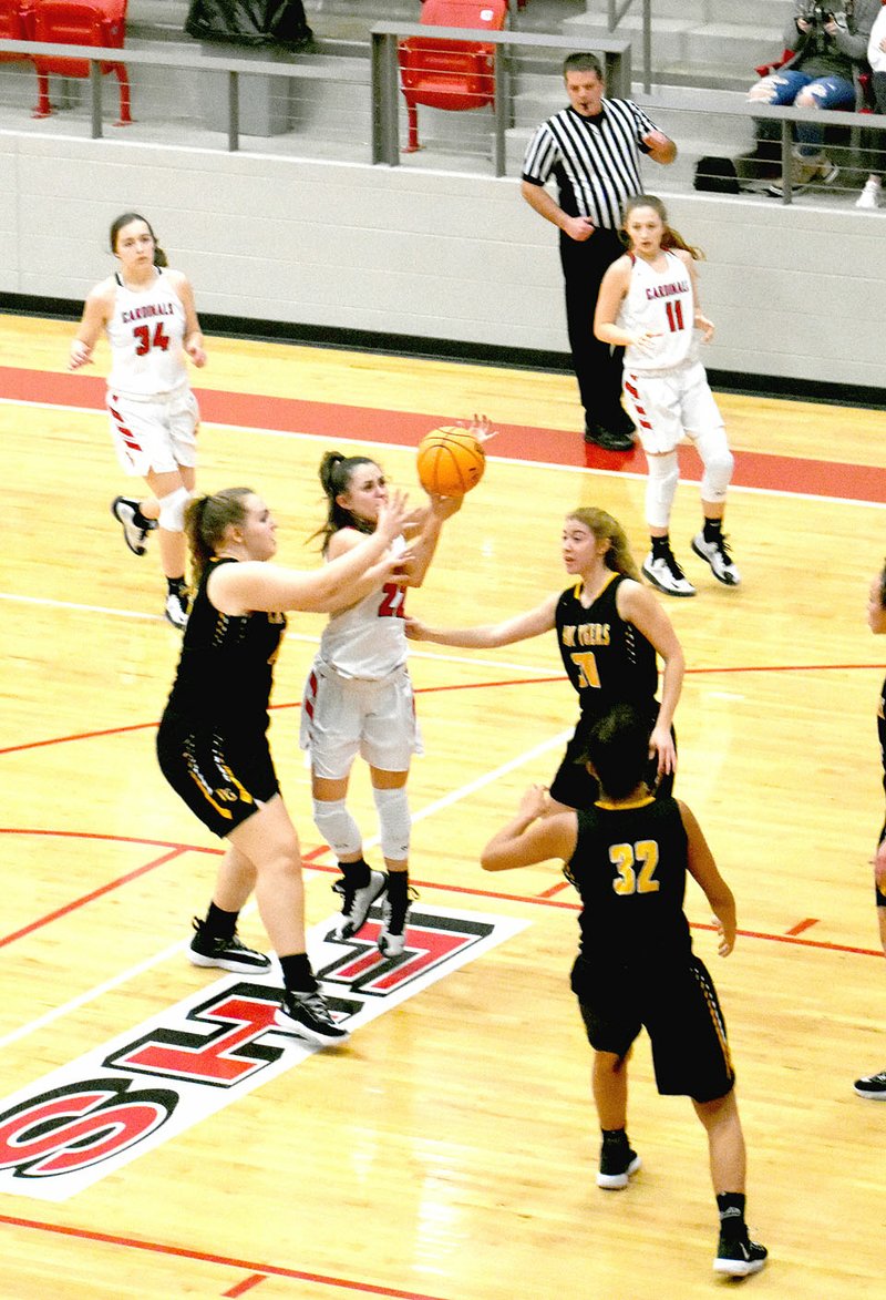 MARK HUMPHREY ENTERPRISE-LEADER Farmington senior Makenna Vanzant draws a foul while penetrating the lane against Prairie Grove Friday, Jan. 31. Vanzant scored 23 points to lead the Lady Cardinals past their rivals 64-34 at Cardinal Arena to stay unbeaten in conference play.