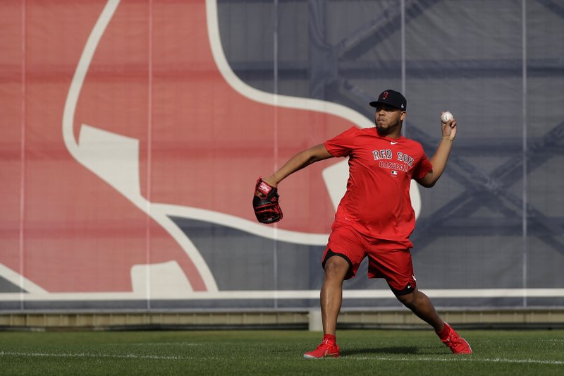 Boston Red Sox reliever Darwinzon Hernandez throws after reporting for spring training Tuesday in Fort Myers, Fla. The Red Sox begin spring training without manager Alex Cora who was fired following the Houston Astros sign-stealing scandal and the trade of 2018 American League Most Valuable Player Mookie Betts in the past month.
(AP/John Bazemore)