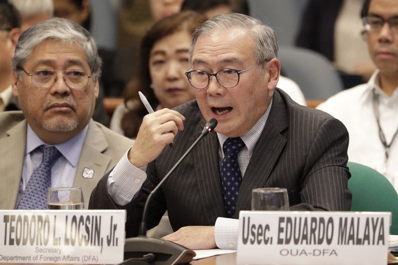 FILE - In this Feb. 6, 2020, file photo, Philippine Secretary of Foreign Affairs Teodoro Locsin Jr. gestures during a senate hearing in Manila, Philippines. The Philippines on Tuesday notified the United States of its intent to terminate a major security pact allowing American forces to train in the country in the most serious threat to the countries' treaty alliance under President Rodrigo Duterte. (AP Photo/Aaron Favila, File)