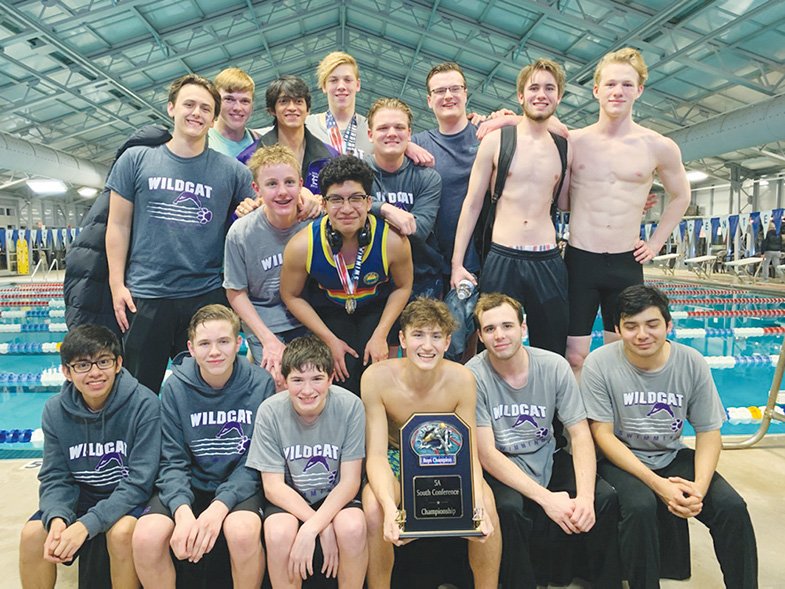 Contributed Photo El Dorado's boys swim team poses with the trophy after winning the 5A South title earlier this week. El Dorado finished with 436 points to knock off Lake Hamilton and Benton.