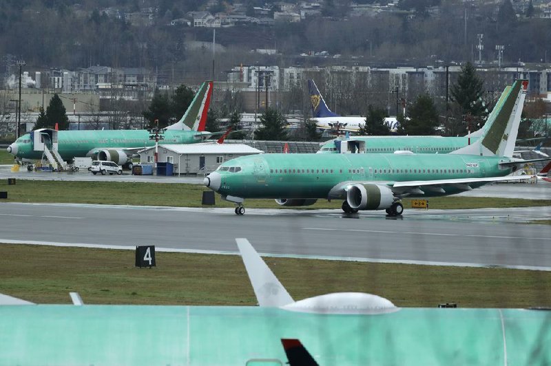 A Boeing 737 Max airplane being built for Norwegian Air International taxis for a test flight in December in Renton, Wash.
(AP/Ted S. Warren)