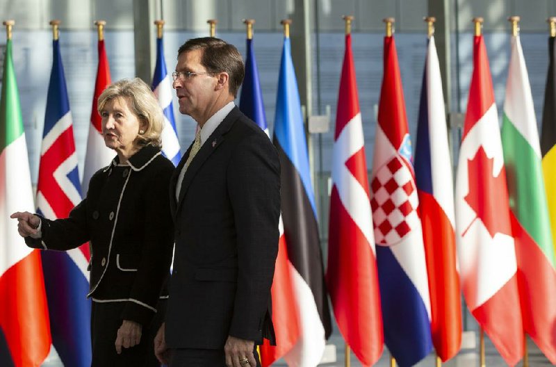 Defense Secretary Mark Esper and U.S. Ambassador to NATO Kay Bailey Hutchison arrive Wednesday for meeting of NATO defense ministers in Brussels. As the U.S. and the Taliban move toward direct peace talks, NATO Secretary General Jens Stoltenberg spoke cautiously about wholesale withdrawal of forces from Afghanistan.
(AP/Virginia Mayo)