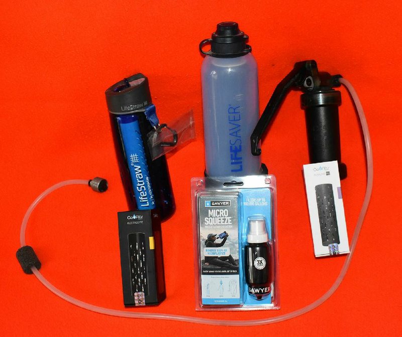 Outdoorsmen can choose from a wide range of microfilters, including (top, from left) the LifeStraw and Lifesaver bottles, the MSR Waterworks pump filter and (bottom) the Sawyer Micro Squeeze. Go+Filtr cartridges fortify filtered water with minerals and electrolytes.
(Arkansas Democrat-Gazette/Bryan Hendricks)