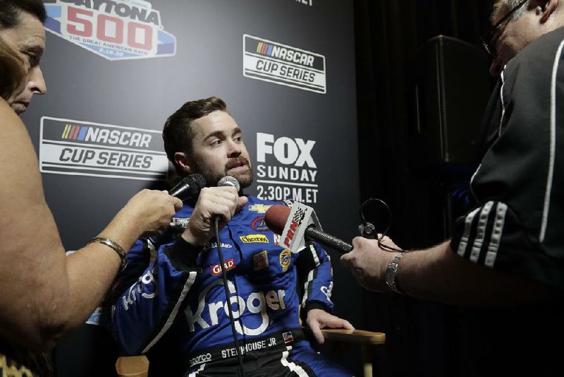 NASCAR Cup Series driver Ricky Stenhouse Jr. of Olive Branch, Miss., answers questions during the Daytona 500 media day Wednesday. Stenhouse, who began his career driving sprint cars at tracks in West Memphis and Little Rock, turned the fastest lap in Daytona 500 time trials on Sunday and will start on the pole in the first of two qualifying races today.
(AP/John Raoux)