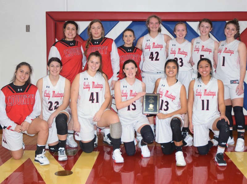 RICK PECK/SPECIAL TO MCDONALD COUNTY PRESS The McDonald County Lady Mustangs beat Joplin, 48-34, on Feb. 8 to take third place in the Ninth Annual Seneca Girls Basketball Tournament.