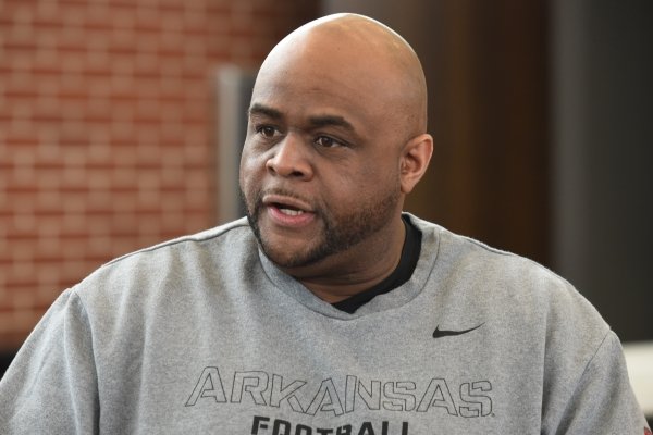 Brad Davis, an assistant coach with the University of Arkansas football team, speaks with members of the media Thursday, February 6, 2020, inside the Fred W. Smith Football Center on the campus in Fayetteville.