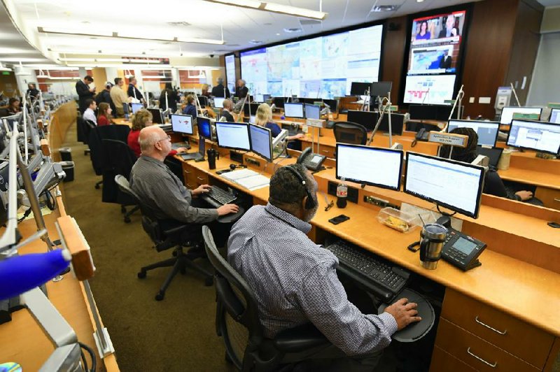 Personnel at the federal Centers for Disease Control and Prevention in Atlanta work Thursday in the Emergency Operations Center, where the coronavirus is among their top priorities.
(AP/John Amis)