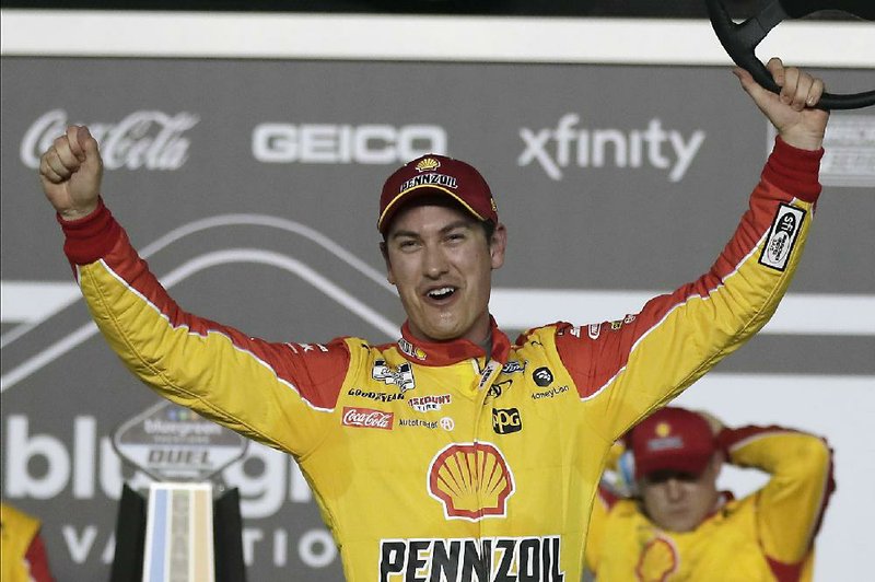 Joey Logano celebrates in Victory Lane after winning the first of two NASCAR Daytona 500 qualifying auto races at Daytona International Speedway, Thursday, Feb. 13, 2020, in Daytona Beach, Fla. (AP Photo/John Raoux)