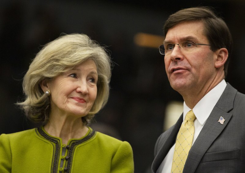 U.S. Secretary for Defense Mark Esper, right, speaks with U.S. Ambassador to NATO Kay Bailey Hutchison during a meeting of the Resolute Support Mission at NATO headquarters in Brussels, Thursday, Feb. 13, 2020. NATO ministers, in a second day of meetings, will discuss building stability in the Middle East, the Alliance's support for Afghanistan and challenges posed by Russia's missile systems. (AP Photo/Virginia Mayo)