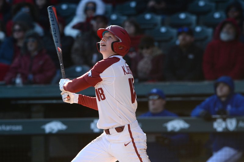 Arkansas right fielder Heston Kjerstad watches Friday, Feb. 14, 2020, as a home run sails over the left field wall during the seventh inning against Eastern Illinois at Baum-Walker Stadium in Fayetteville.