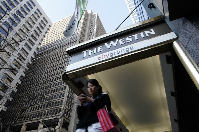 This file photo shows the Westin Philadelphia hotel, a Marriott International-owned property, in Philadelphia. While fewer hotels are placing Bibles in their rooms, Marriott — which owns Westin — requires almost all of its 30 brands to keep copies of the Bible and the Book of Mormon available in guest rooms.
(AP/Matt Rourke)