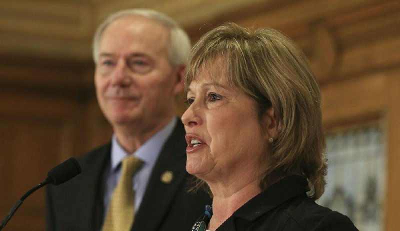 Courtney Pledger appears with Gov. Asa Hutchinson in March 2017 after she was introduced as executive director of the Arkansas Educational Television Network. On Thursday, Pledger announced that the network is changing its name to Arkansas PBS as part of a national wave of changes in public television networks.
(Arkansas Democrat-Gazette/Staton Breidenthal)