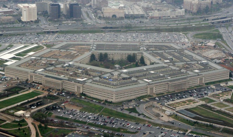 FILE - This March 27, 2008, aerial file photo, shows the Pentagon in Washington. A Federal court has ordered the Pentagon to temporarily halt work with Microsoft on its $10 billion military cloud contract, Thursday, Feb. 13, 2020, after Amazon sued alleging that President Donald Trump's bias against the company hurt its chances to win the project. Amazon requested the court issue the injunction last month. Both the documents requesting the block and the judge's decision to issue the temporary injunction are sealed by the court.  (AP Photo/Charles Dharapak, File)