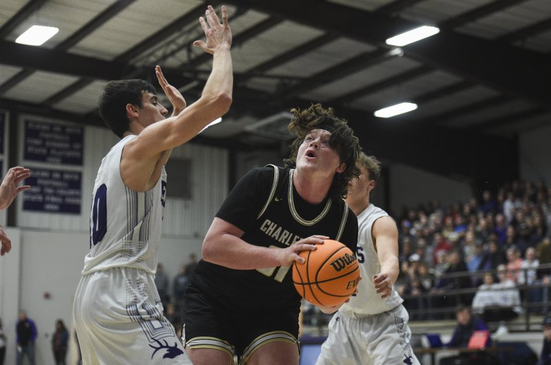 Charleston guard Brayden Ross (31) drives the ball, Friday, February 14, 2020 during a basketball game at Elkins High School in Elkins.