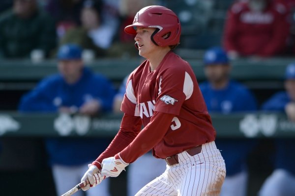 Arkansas third baseman Jacob Nesbit hits a single Saturday, Feb. 15, 2020, to score center fielder Christian Franklin during the third inning against Eastern Illinois at Baum-Walker Stadium in Fayetteville. Visit nwaonline.com/200216Daily/ for today's photo gallery.