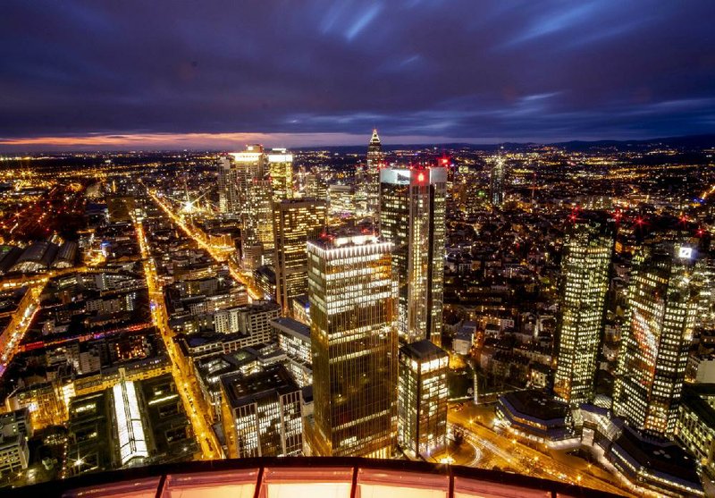 The buildings of Frankfurt’s banking district are pictured after the sun set Friday in Germany.
(AP/Michael Probst)