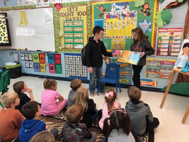 In preparation for the Great Kindness Challenge, Magnet Cove Elementary is practicing different ways of sharing kindness all month. Students shared their time when they came in during their break to read to kindergarten students, including fifth-grader Trevor McGriff, left, and sixth-grader Isabella Wilson. - Submitted photo