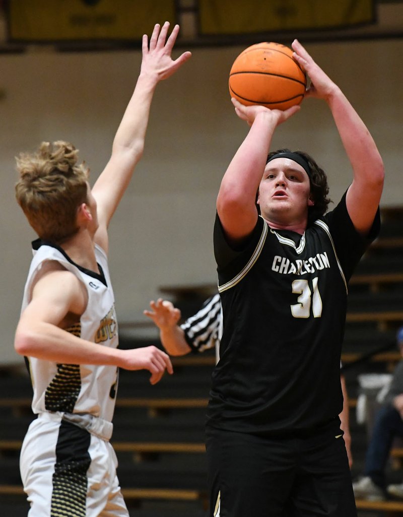 Brayden Ross of Charleston shoots over a defender during a victory at West Fork last week. Ross is a senior who plays basketball, football, baseball, and golf at Charleston. (NWA Democrat-Gazette/J.T. Wampler)