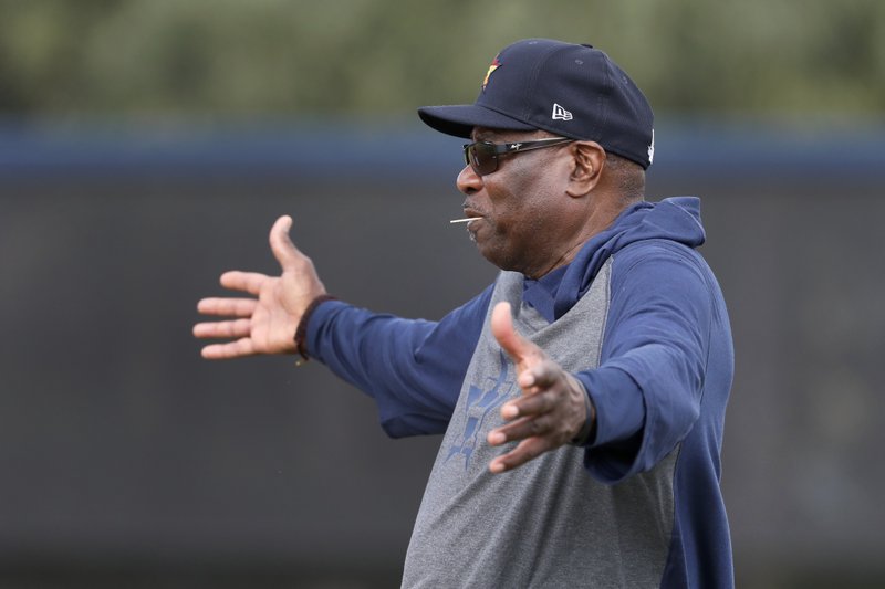 Houston Astros manager Dusty Baker gestures as he watches his team during spring training baseball practice Thursday, Feb. 13, 2020, in West Palm Beach, Fla. (AP Photo/Jeff Roberson)