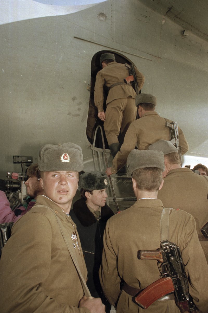 FILE -in this Feb. 13, 1989, file photo, the last Soviet unit climbs aboard a Soviet military transport plane in Kabul, Afghanistan, as Soviet troops complete their withdrawal after a decade of military occupation. Afghanistan is marking the 31st anniversary of the Soviet Union's last soldier leaving the country, Saturday, Feb. 15, 2020. This year's anniversary comes as the United States negotiates its own exit after 18 years of war, America's longest. - AP Photo/Laurent Rebours