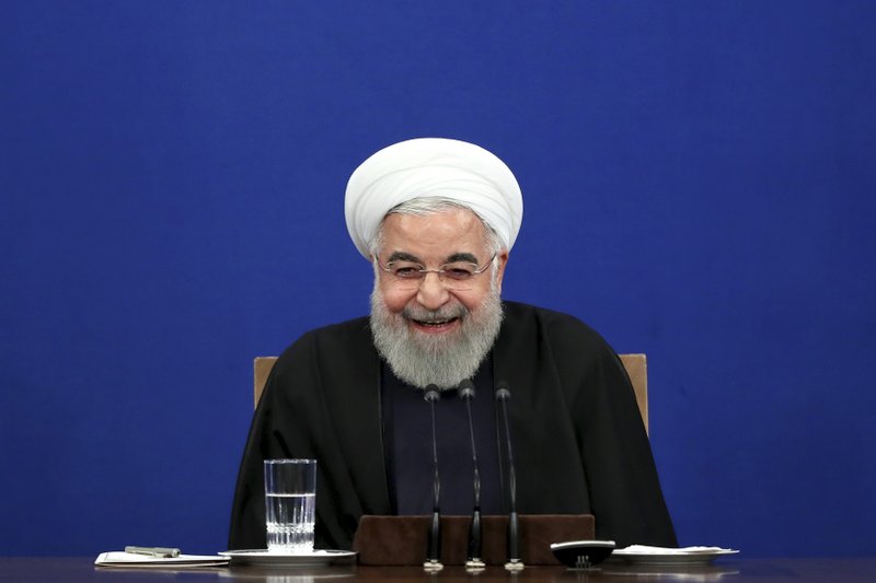 Iran's President Hassan Rouhani smiles during a press conference in Tehran, Iran, Sunday. - AP Photo/Ebrahim Noroozi