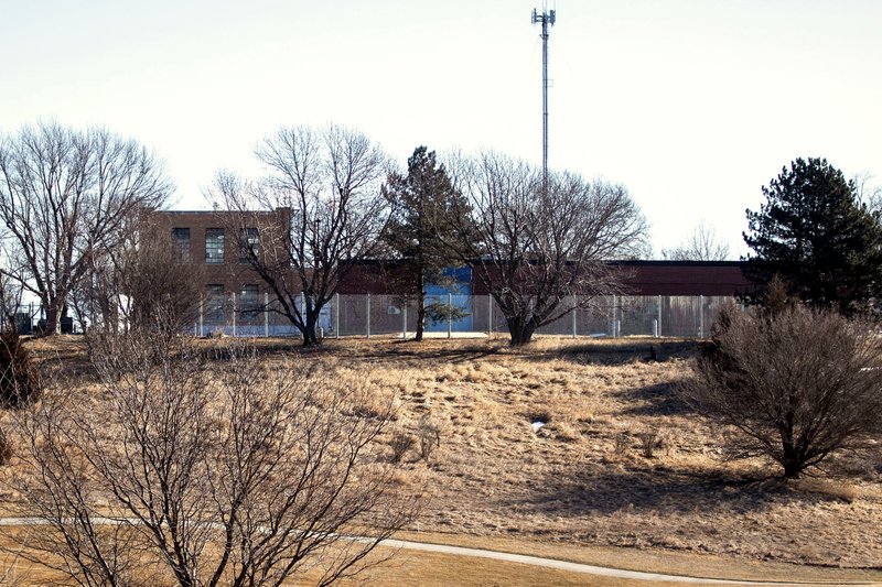 In this Feb. 13, 2020 photo, a fence surrounds the Youth Rehabilitation and Treatment Center in Kearney, Neb. Two state-run homes for Nebraska's high-risk juvenile offenders are facing new scrutiny after a string of high-profile escapes and violence. The incidents at the Youth Rehabilitation and Treatment Centers in central Nebraska have escalated to the point that state officials are moving the most violent youths to separate facilities and lawmakers are proposing millions of dollars in facility upgrades to try to keep them and the adults who treat them safe. (Kayla Wolf/Omaha World-Herald via AP)