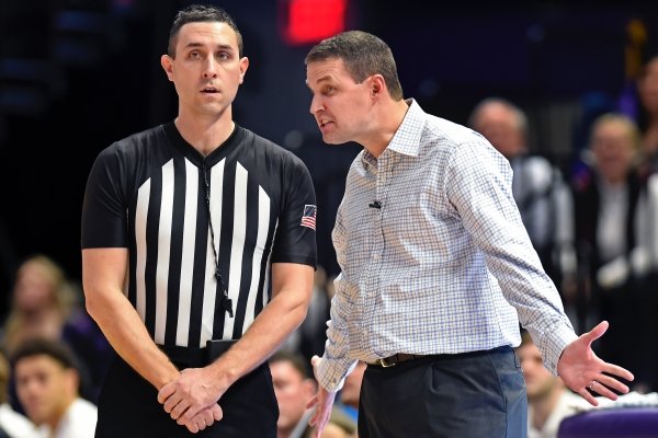 LSU head coach Will Wade, right, complains to referee Todd Austin concerning a call late in the second half of an NCAA college basketball game, Tuesday, Feb. 11, 2020, in Baton Rouge, La. LSU won 82-78. (AP Photo/Bill Feig)