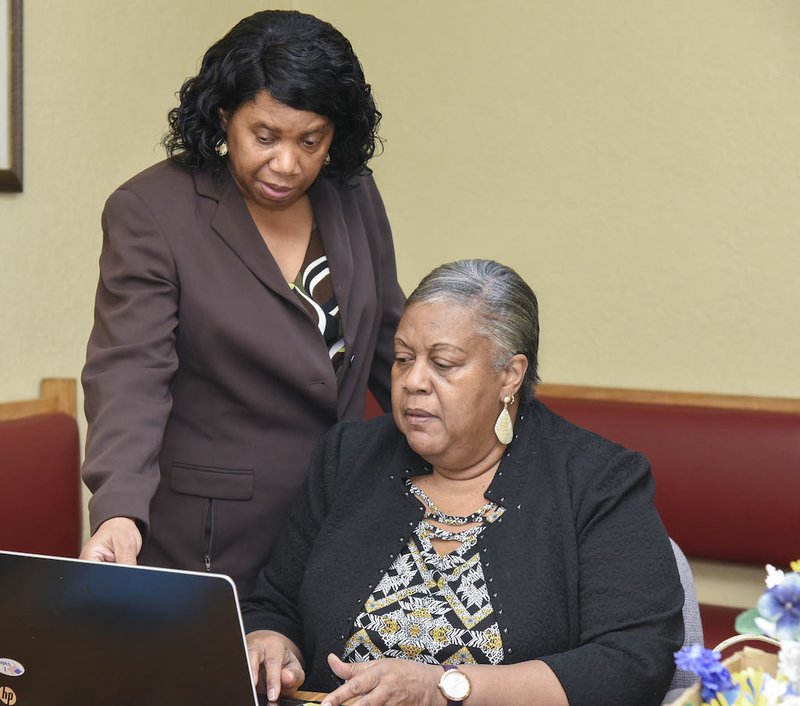 President of the NAACP, Linda Franklin, left, works on the programs for the 2020 MLK Prayer Breakfast at the Webb Community Center on January 15. -photo by Grace Brown of the Sentinel-Record