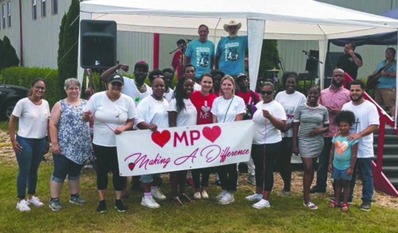 Brittney Howard and several volunteers are photographed after a fundraiser hosted by Howard's nonprofit, "Mountain Pine Street Reach."-submitted photo