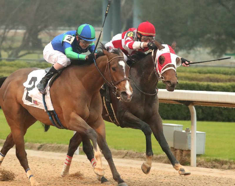 Brian Hernandez (left) leads Go Google Yourself (2) to victory past Whoa Nellie in the Bayakoa Stakes at Oaklawn.
(The Sentinel-Record/Richard Rasmussen