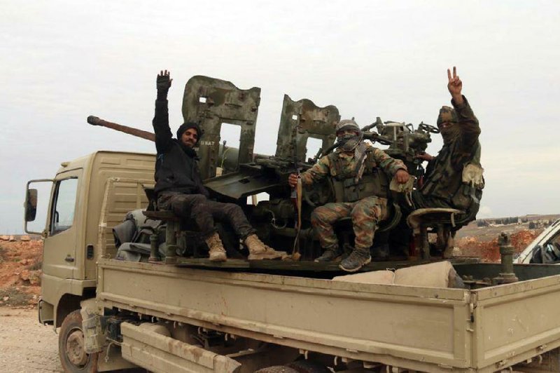 Syrian soldiers patrol the village of Tallet Shweihna in Aleppo province in a photo released Sunday. In recent weeks, government forces have consolidated their hold over the province.
(AP/SANA)