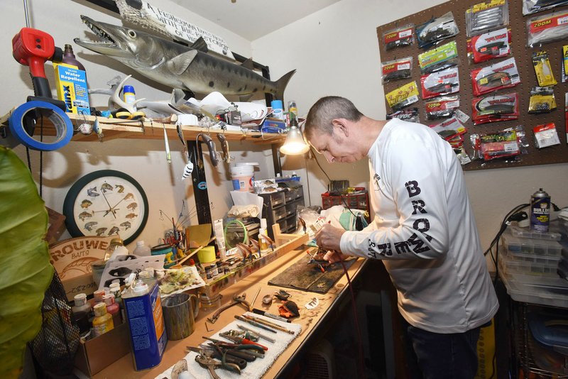 Local artist Rick Brouwer does all his lure work at a work bench in the corner of his garage. “Some people think I have some big operation going here,” he said.
(NWA Democrat-Gazette/Flip Putthoff)