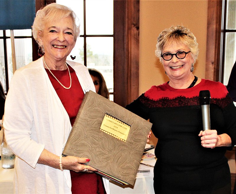 Diann Northern, left, Hot Springs Women's Welcome Club's 2029 president, was honored for her service at the Feb. 5 club meeting. WWC photographer Donna Sheppard presented her with a scrapbook to commemorate her year of service. - Submitted photo