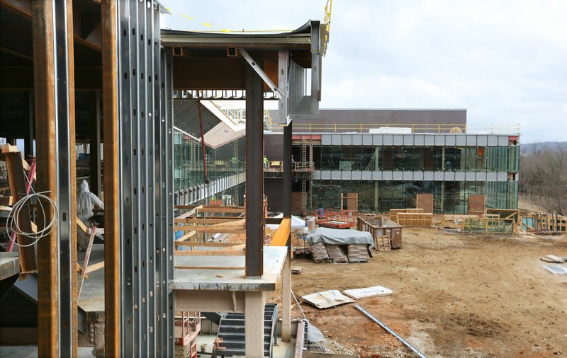 Work continues Monday on the expansion of the Fayetteville Public Library. The addition will nearly double the size of the library. Go to nwaonline.com/200218Daily/ and nwadg.com/photos for a photo gallery. (NWA Democrat-Gazette/David Gottschalk)