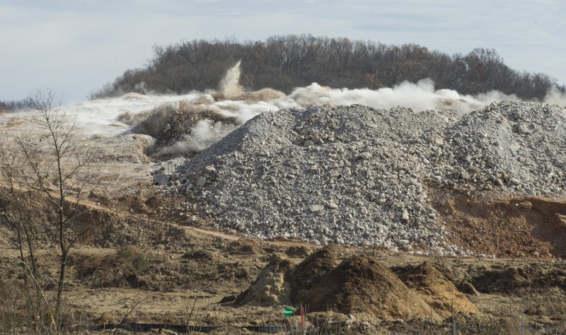 In this Nov. 20, 2019, file photo, explosives detonate to blast away a section of rock at the construction site for the new Interstate 49 Bella Vista Bypass interchange in Bentonville. (NWA Democrat-Gazette/BEN GOFF)