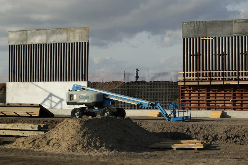 In this Nov. 7, 2019 file photo, the first panels of levee border wall are seen at a construction site along the U.S.-Mexico border, in Donna, Texas. The Trump administration said Tuesday, Feb. 18, 2020, that it will waive federal contracting laws to speed construction of the border wall with Mexico. (AP Photo/Eric Gay, File)