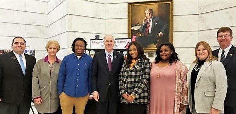 Pictured left to right, Justin Neel, President, Arkansas ACTE; Anita Moore, Magnolia High School Internship Coordinator; Jeremiah Smith, MHS Internship student for the City of Magnolia; Arkansas  Governor Asa Hutchinson; Caitlin Jermany, MHS Internship student at Panther Plaza; A’Nijah Caldwell, Internship student for Kindergarten Center; Dr. Angela Kremers, Director, ADE- Division of Career & Technical Education; and Johnny Key, Secretary of Education.