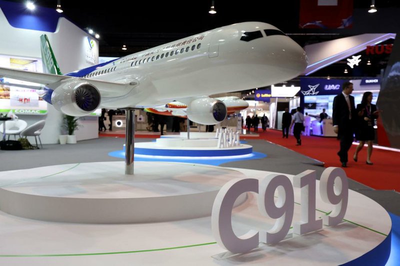 A model of the Commercial Aircraft Corp. of China c919 aircraft is displayed at the Changi Exhibition Centre in Singapore.