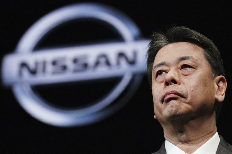 FILE - In this Dec. 2, 2019, file photo, Nissan Chief Executive Makoto Uchida speaks during a press conference in the automaker's headquarters in Yokohama, near Tokyo. Nissan shareholders unleashed their anger at the Japanese automaker's management Tuesday, Feb. 18, 2020, for crashing stock prices, zero dividends and quarterly losses after the scandal-ridden departure of former Chairman Carlos Ghosn. (AP Photo/Eugene Hoshiko, File)