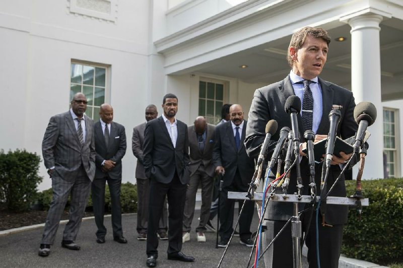 Former NFL players, including Jerry Rice and Jim Brown, listen Tuesday as White House deputy press secretary Hogan Gidley announces the decision to pardon former San Francisco 49ers owner Edward DeBartolo, who pleaded guilty two decades ago for failing to report a felony. “I take my hat off to Donald Trump for what he did,” Rice said, calling it a “great day.”
(AP/Alex Brandon)