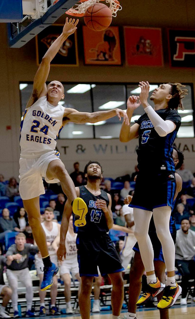 Photo courtesy of JBU Sports Information John Brown sophomore Ira Perrier goes in for a dunk late in the second half against Southwestern Christian on Saturday at Bill George Arena.