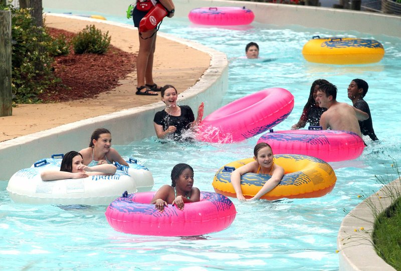Patrons float around the Kodiak Caynon Adventure River at Magic Springs Theme and Water Park in May 2019. - File photo by Richard Rasmussen of The Sentinel-Record