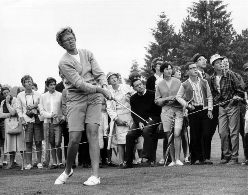 FILE - In this 1967 file photo, The gallery follows Mickey Wright's iron shot from the fairway at the Toronto Golf Club in 1967. Hall of Fame golfer Wright, who won 82 LPGA tournaments including 13 majors, died Monday of a heart attack, her attorney said. Wright was 85. - The Associated Press File Photo